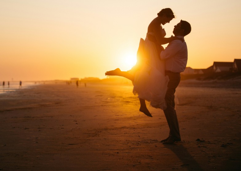 Couple embracing at sunset
